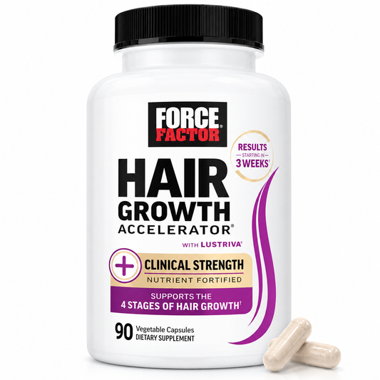 A white bottle of Force Factor Hair Growth Accelerator dietary supplement with a black cap, shown on a white background with two beige capsules in front.